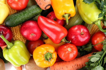 Assortment of fresh vegetables and fruits as a background