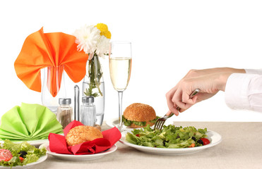 Female hand with  dinner isolated on white