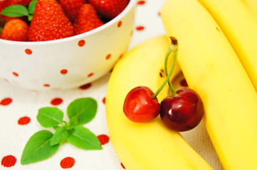 Beautiful strawberries ,apple,bananas and cherry