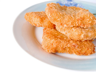 fish sticks in dish on a white background