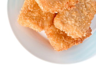 fish sticks in dish on a white background