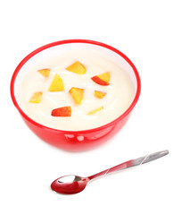 Yoghurt with peach in bowl isolated on white