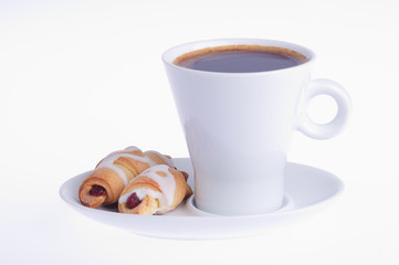 coffee with two croissants on a saucer on a white background