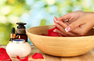 spa treatments for female hands,  on green background