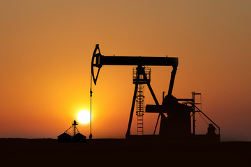 isolated oil pump at sunset