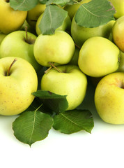juicy apples with green leaves, isolated on white