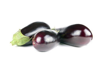 Three eggplants on white background