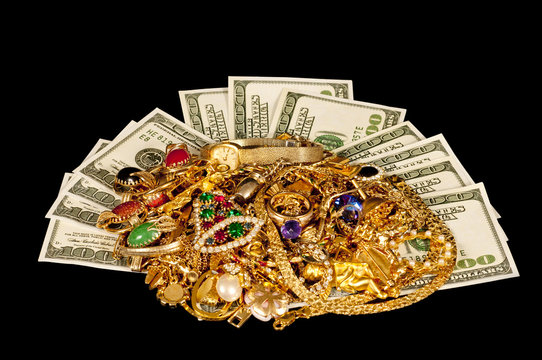 Cash With Gold Jewelry On Black Cloth Background