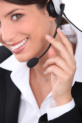 Young woman wearing telephone head set