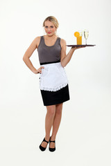 Waitress bringing drinks on a tray.