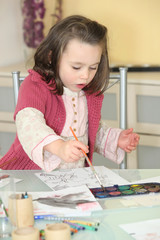 Little girl painting