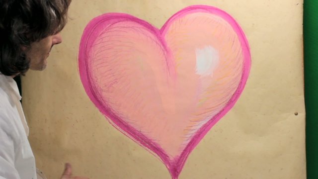 artist at work on heart sketch