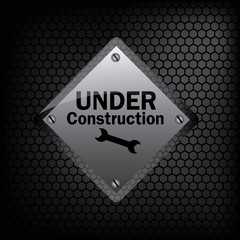 under construction sign on metal background vector