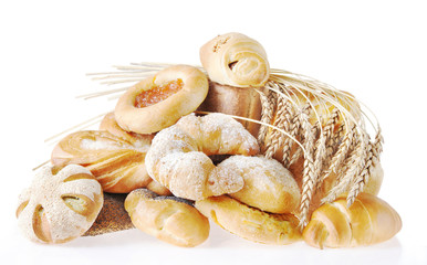 Composition with bread and buns on light background