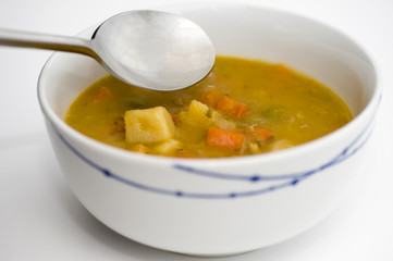 Chicken soup with spoon