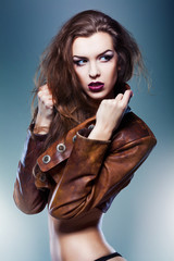 pretty attractive erotic woman in brown jacket