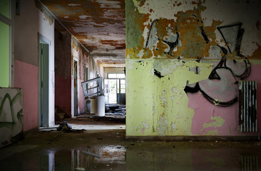 abandoned building, empty room with graffiti on the wall