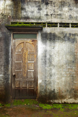 Laos, Pakse. Rural hause. Old door. Humidity. Oxide
