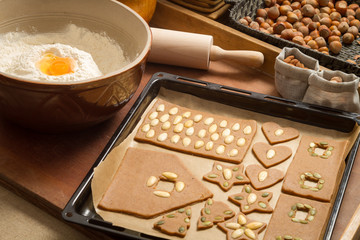Decorating gingerbread cookies nuts just before baking