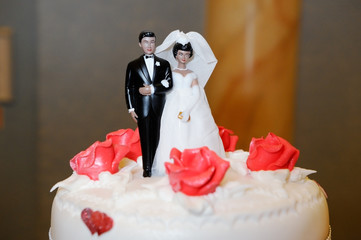 Bride and groom on cake