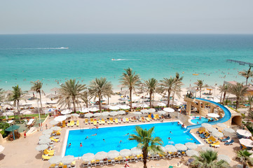 Swimming pool near beach at luxury hotel, Sharjah, UAE - 46783986
