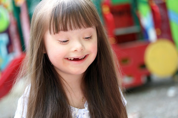 Portrait of beautiful young girl on the playground.