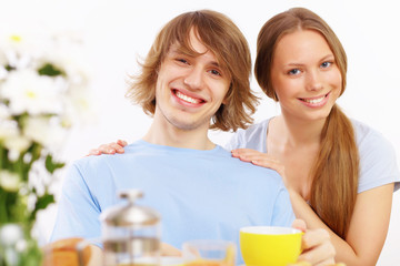 Couple at home drinking tea