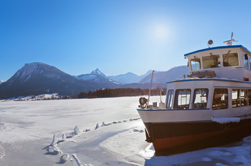 Ship in ice - village St Wolfgang on the lake Wolfgangsee - Aust