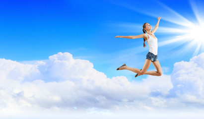 Modern style dancer against blue sky