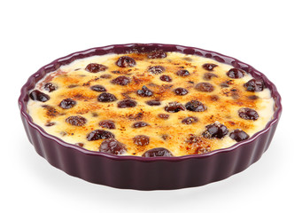 cream brulee with cherries isolated on white with clipping path