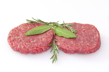 raw hamburgers isolated on white background