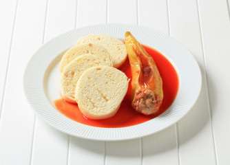 Stuffed pepper with tomato sauce and dumplings