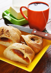 Bun with jam and cup of tea for five-o-clock