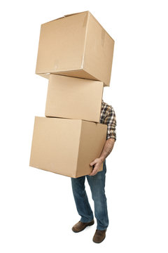 Man carrying stack of cardboard boxes