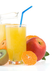 fresh tropical fruits and juice in glass