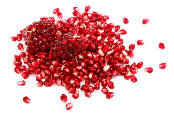 Pomegranate seeds on a white background.