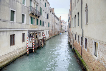 Fototapeta na wymiar Facades of houses and channel between houses in city Venice