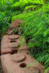 Fern Green brown stone wall with a curve