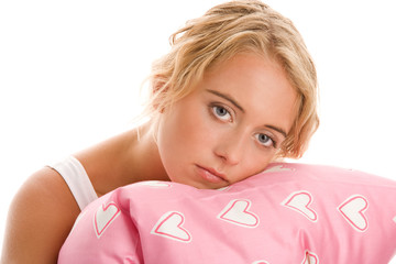 Obraz na płótnie Canvas Smutna kobieta z poduszką