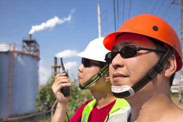 close up of  two asian refinery workers