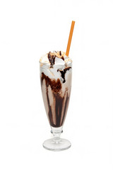 Hot chocolate with syrup in glass cup
