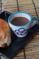 Black bread with sausage, hot coffee