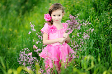 portrait of little girl outdoors in summer