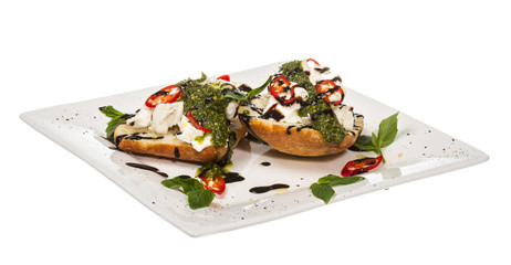 Fresh toast sandwiches with cheese and basilic and pesto.