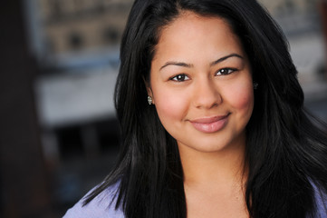 Attractive young hispanic smiling woman portrait.