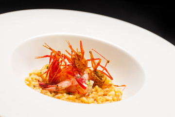 Stylish risotto dish in deep bowl.