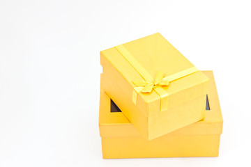 yellow gift box on white paper