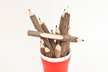 many color pencil in red cup