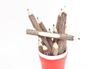 many color pencil in red cup