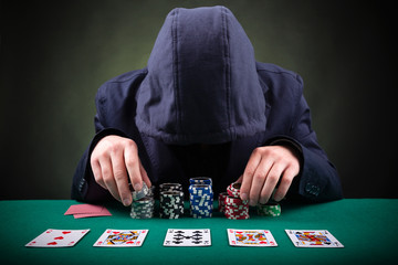 Poker player on black background